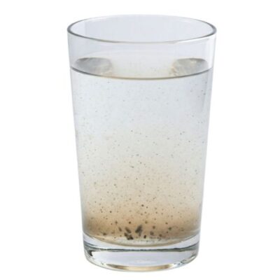 A glass of dirty tap water