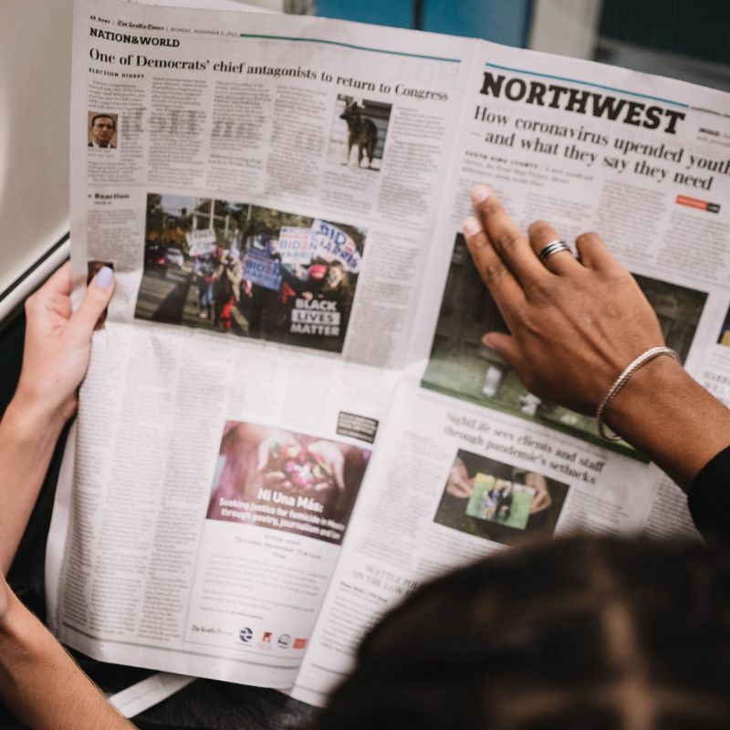 Person reading newspaper
